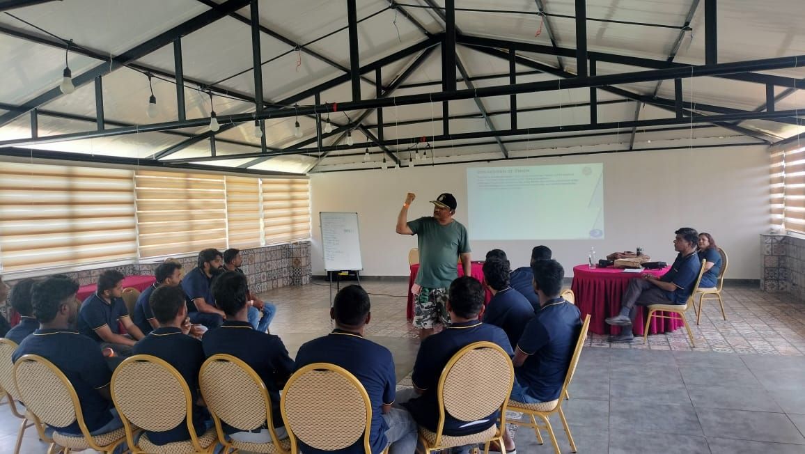 Facilitator leading an indoor learning session